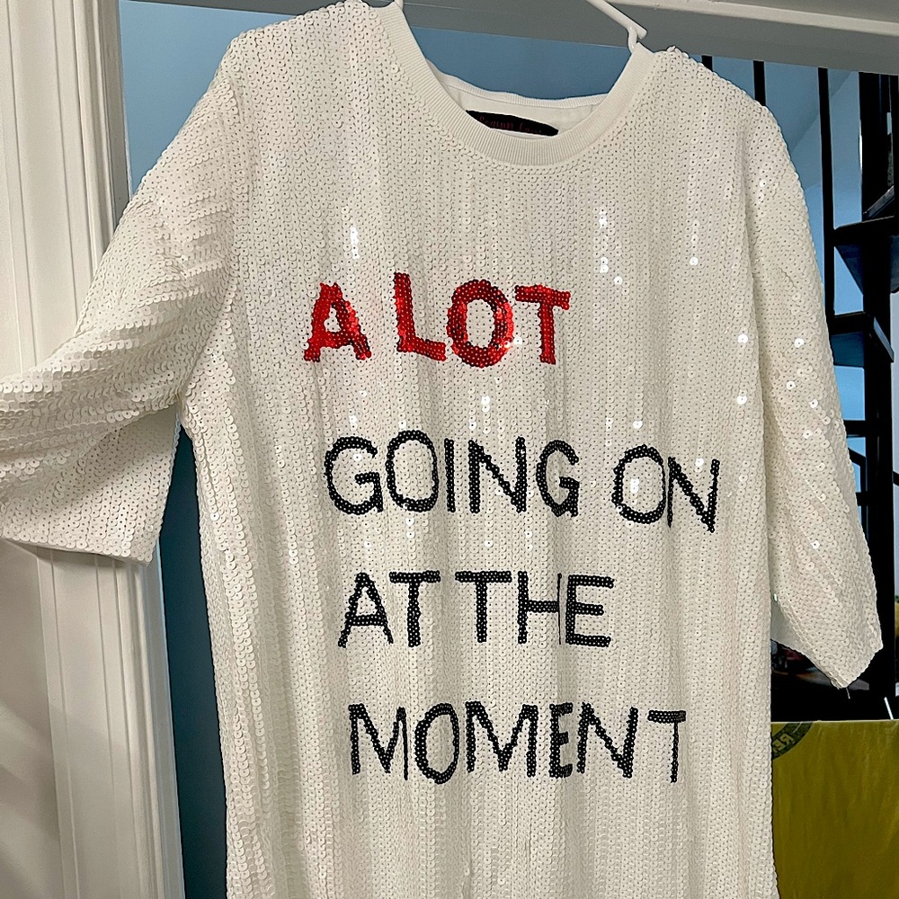 Taylor Swift “a lot going on at the moment” sequin dress